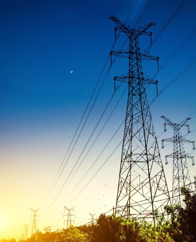 sun-setting-silhouette-electricity-pylons
